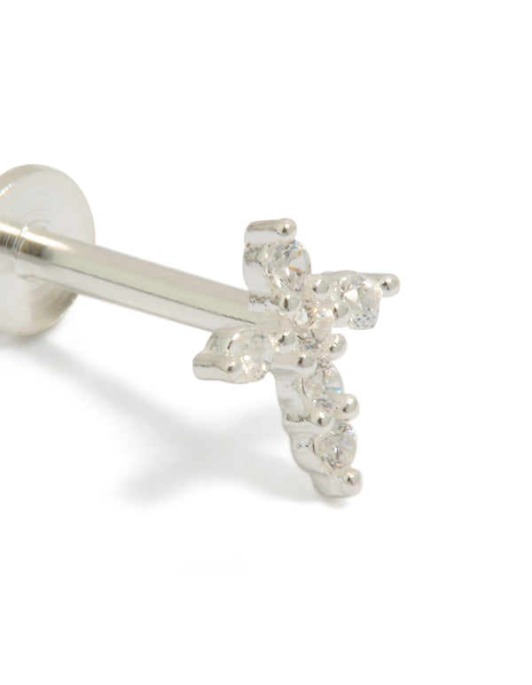 Showcasing a sterling silver cross stud with cubic zirconia stones and flat back design close up view
