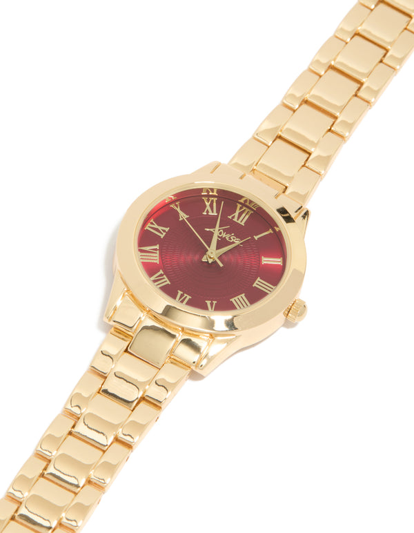 Elegant women's analog watch with brown roman numeral dial, round shape, link band strap in gold for formal occasions view