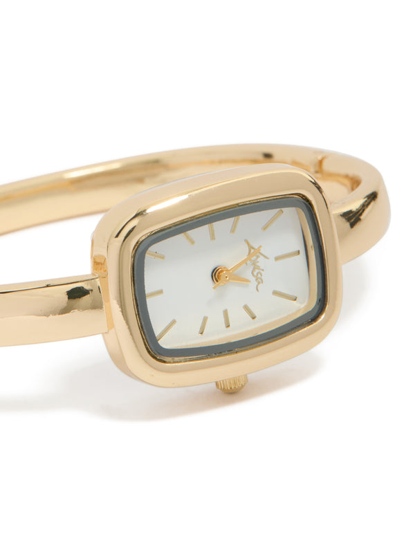 Showcasing a women's analog bangle watch with white dial and rectangle shape, featuring a link-band in gold strap color for formal occasion wear, watch face detail view