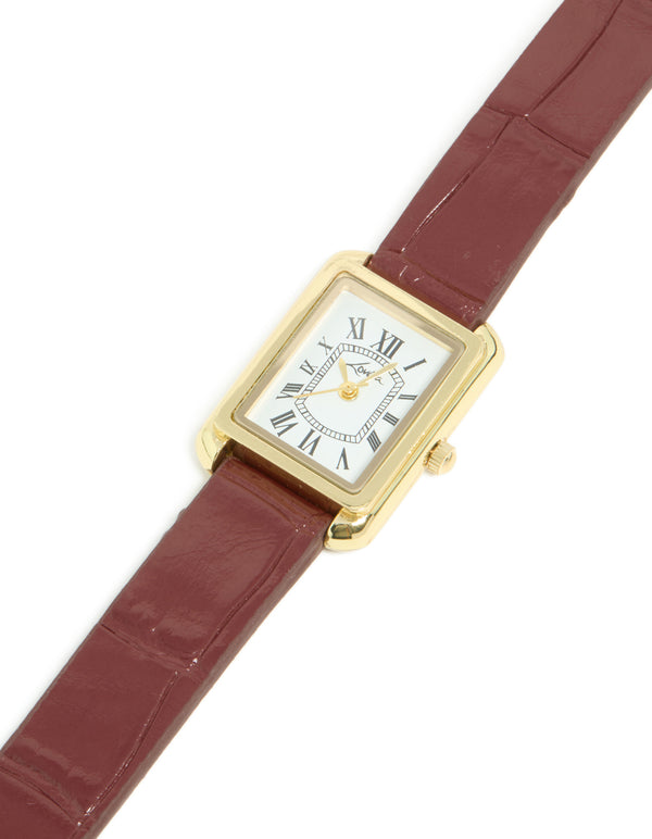 Discover a women's analog watch with white roman dial, rectangle shape, brown leather strap, and gold accents crafted from PU material for formal occasions front view
