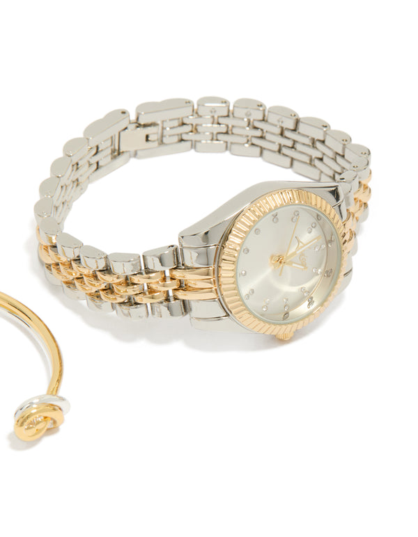 Beautifully crafted mixed metal knotted wrist cuff and watch set with silver dial featuring stone look, round shape, link band designed for women's formal occasions, analog type, silver plated material, gold accents watch face detail view
