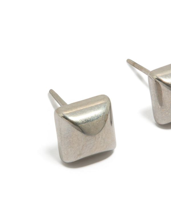 Showcasing mens waterproof stainless steel studded earrings in silver featuring stud closure close up view