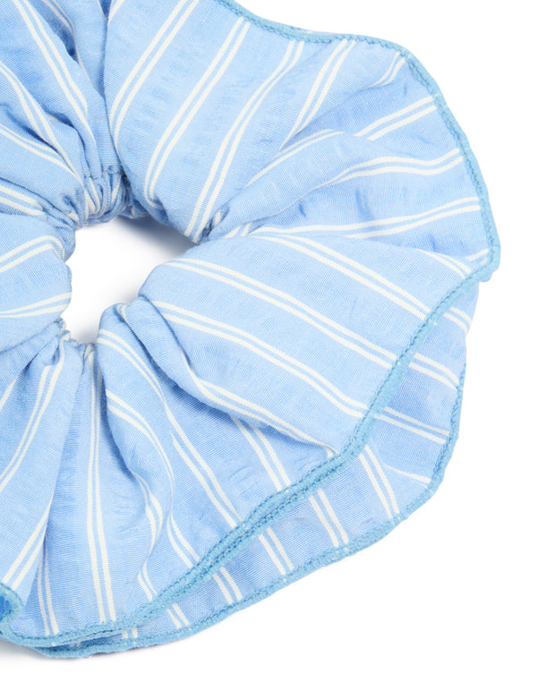 Featuring pale blue fabric ruffle scrunchie with white stripe print in a statement style detail view