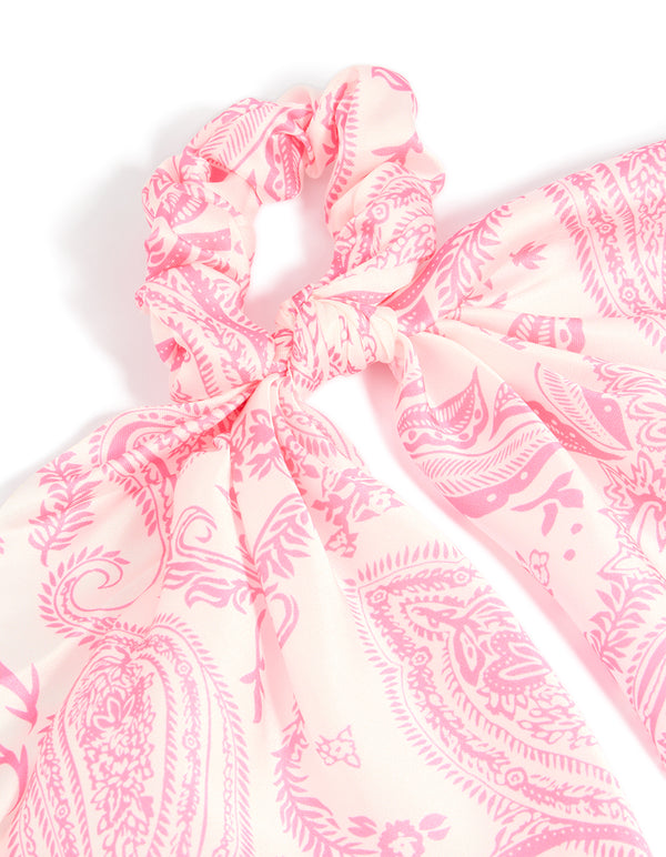 Showcasing a pink boho pattern fabric scarf scrunchie with print in hot pink and misty rose shades detail view