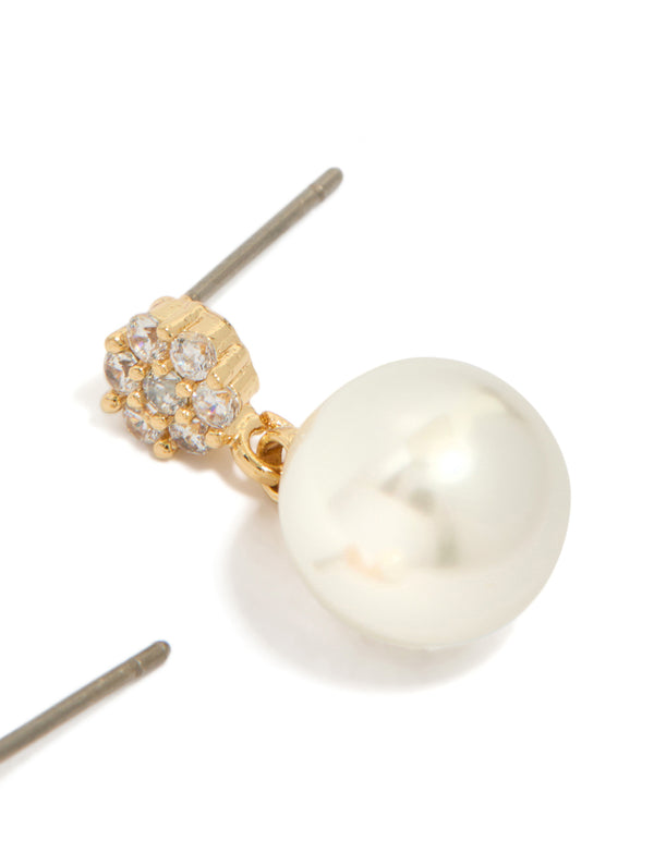 Crafted from gold plated material featuring small round cubic zirconia and pearl drop earrings in white post detail view