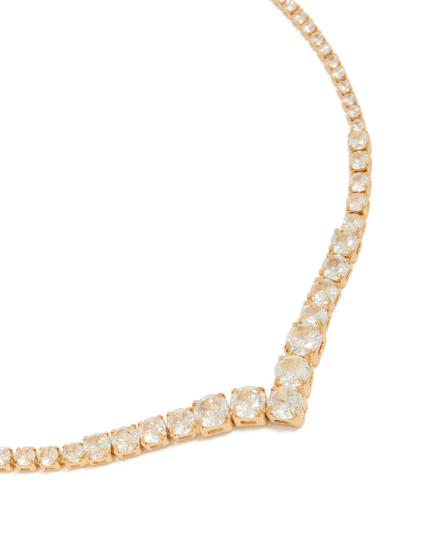 Showcasing a gold plated gradient bezel cubic zirconia necklace with statement style close up view