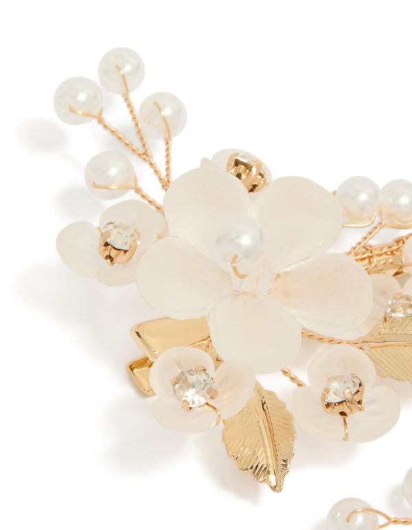 This gold plated pearl and acrylic flower clip showcases leaf accents with floral details in ivory and white side view