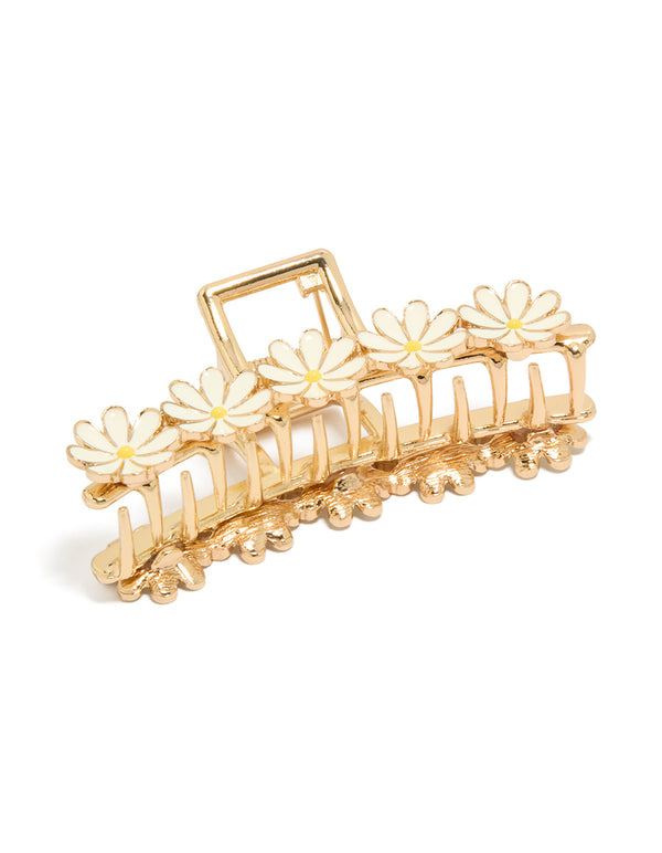 Showcasing a white enamel daisies floral claw clip in gold front view