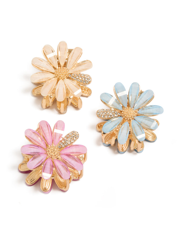 Discover glitter floral print 3-pack gold pastel daisy claw clips in pink, powder blue, and peachpuff front view