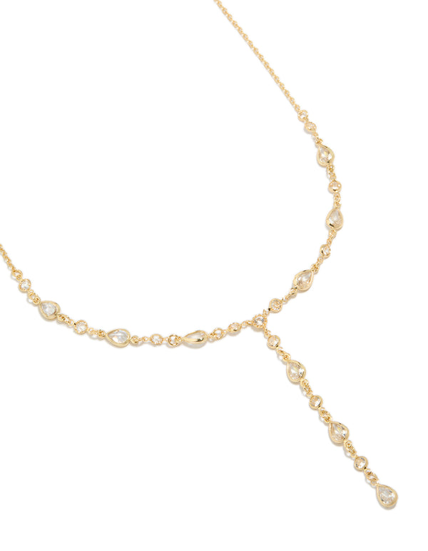 Showcasing a gold plated cubic zirconia alternating Y-necklace in statement style close up view