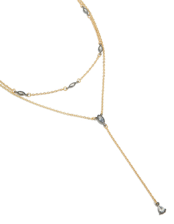 Showcasing a mixed metal teardrop diamante drop Y-necklace crafted from plated material in statement style close up view