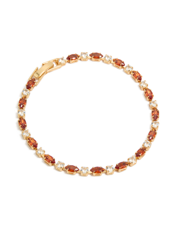 Showcasing a gold plated tennis bracelet with clear and cognac cubic zirconia in multi cut design front view