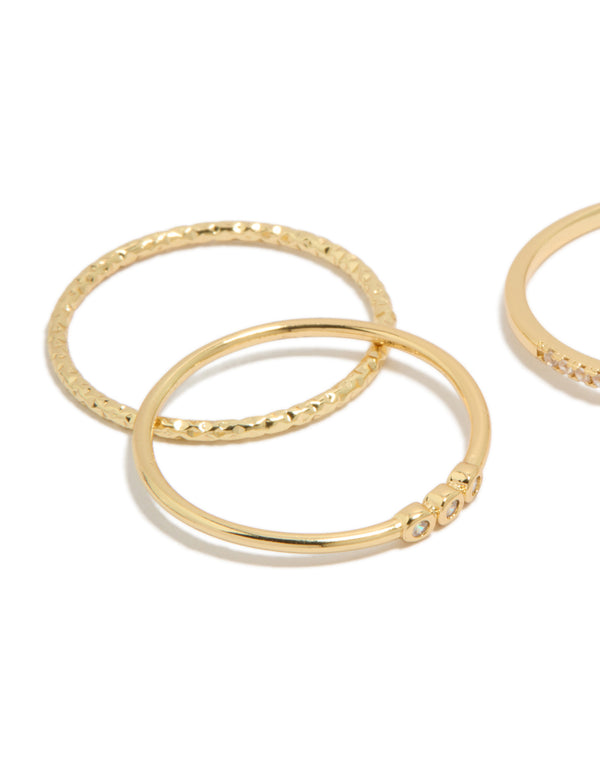 Highlighting gold plated cubic zirconia square bezel rings with statement stackable design close up view