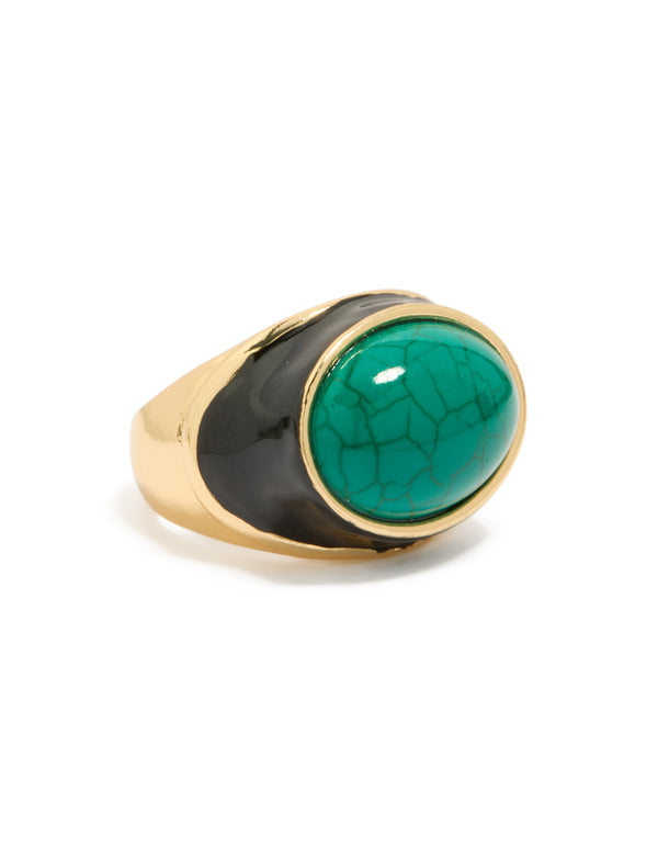 Showcasing a gold plated ring with black enamel and chunky turquoise stone side detail view