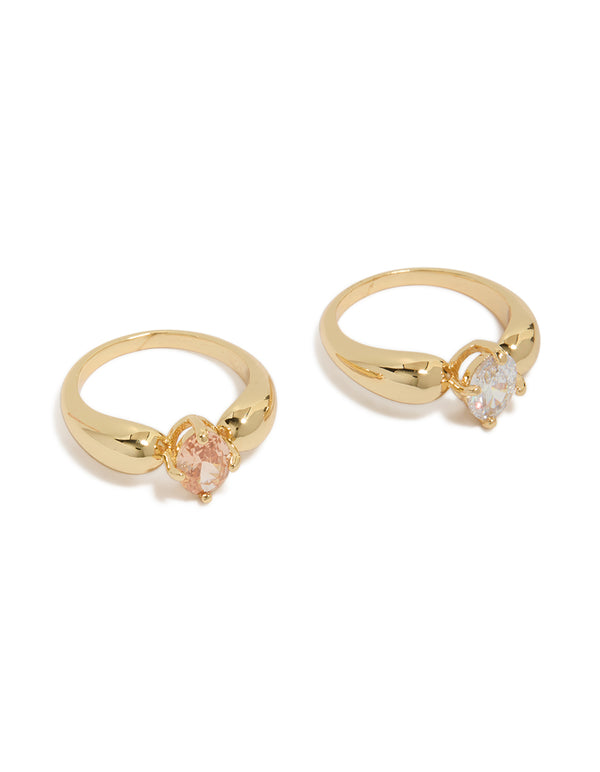 Beautifully crafted cubic zirconia clear and orange puffy rings in a 2-pack featuring gold plated metal with statement style front view