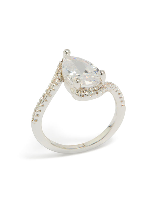 Featuring a silver plated pear cubic zirconia engagement ring with crystal embellishments and statement styling in clear front view