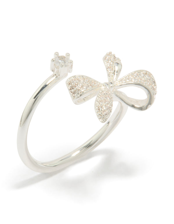 Showcasing a bow crafted from silver plated material with clear cubic zirconia in dainty style wrap ring side detail view