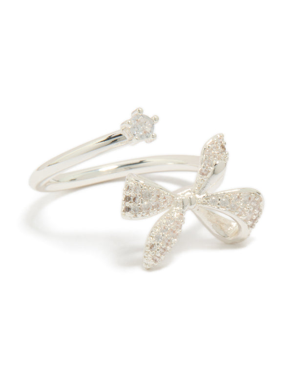 Featuring a bow crafted from silver plated material with clear cubic zirconia in dainty style wrap ring front view