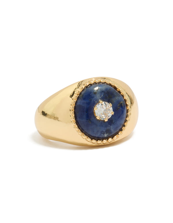 Showcasing a gold plated chunky cubic zirconia blue stone ring with statement styling front view
