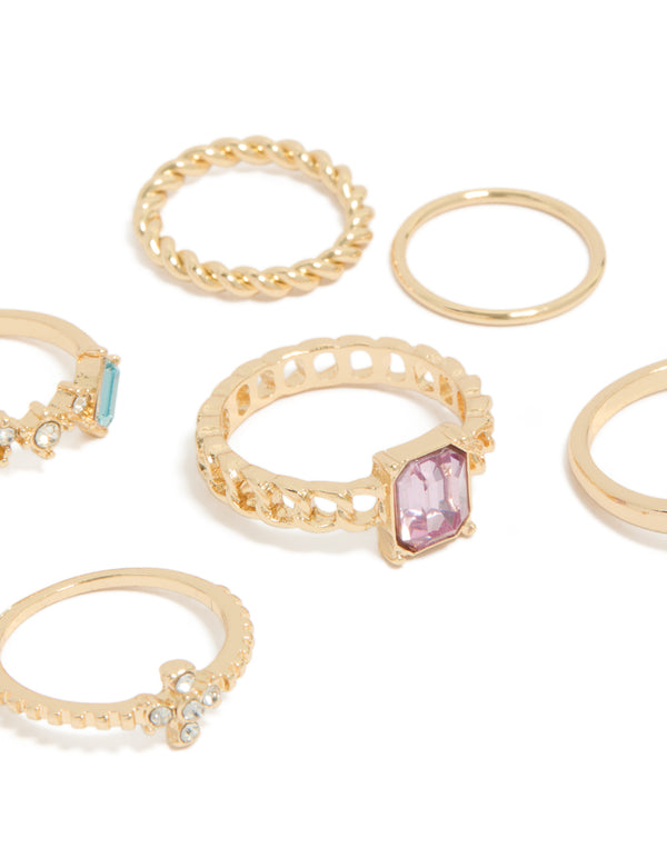 Showcasing gold mixed diamante and twisted rings in a stackable statement 6-pack close up view