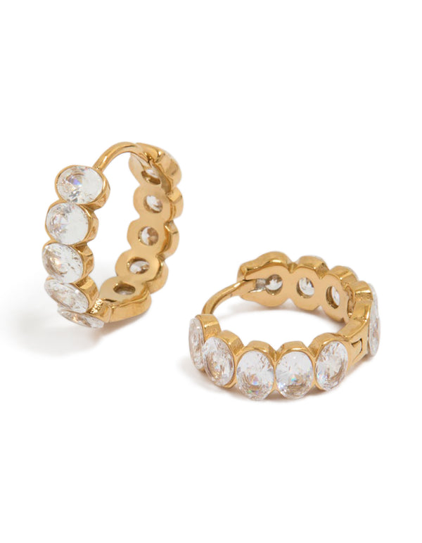 Discover waterproof huggie earrings crafted from gold plated stainless steel featuring round bezel set cubic zirconias in clear front view