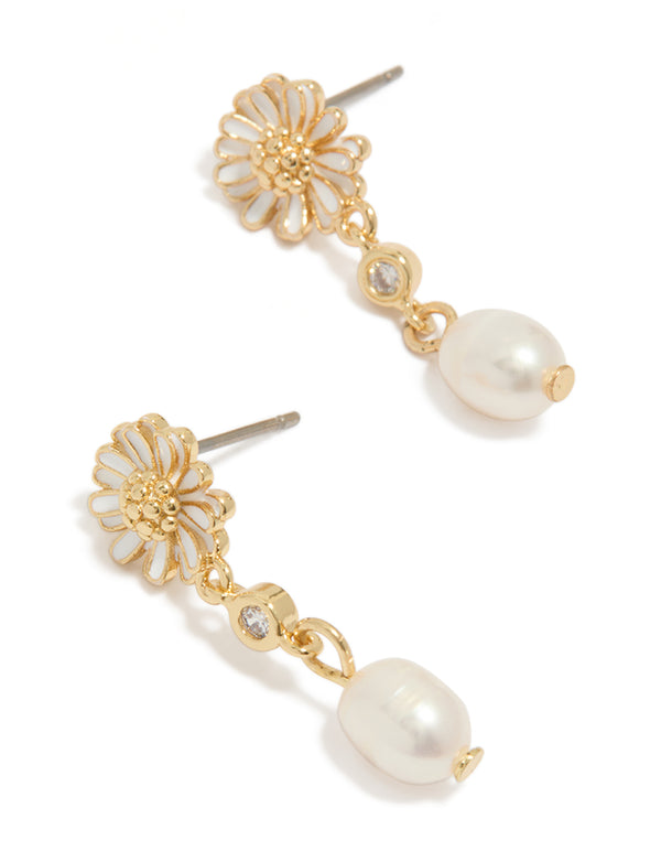 Showcasing gold plated white enamel daisy and freshwater pearl drop earrings with floral design front view