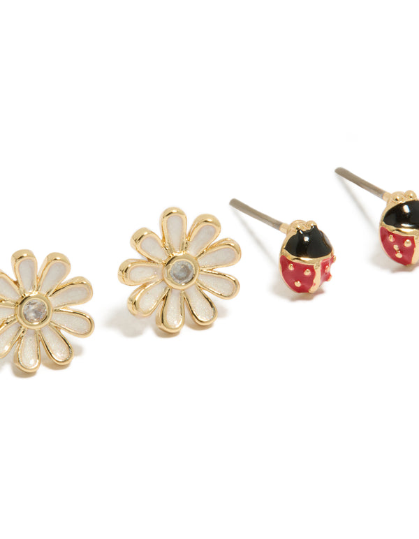 Crafted from enamel, crystal, and cubic zirconia, this stud style 2-pack showcases animal ladybug and floral in gold plated finish close up view