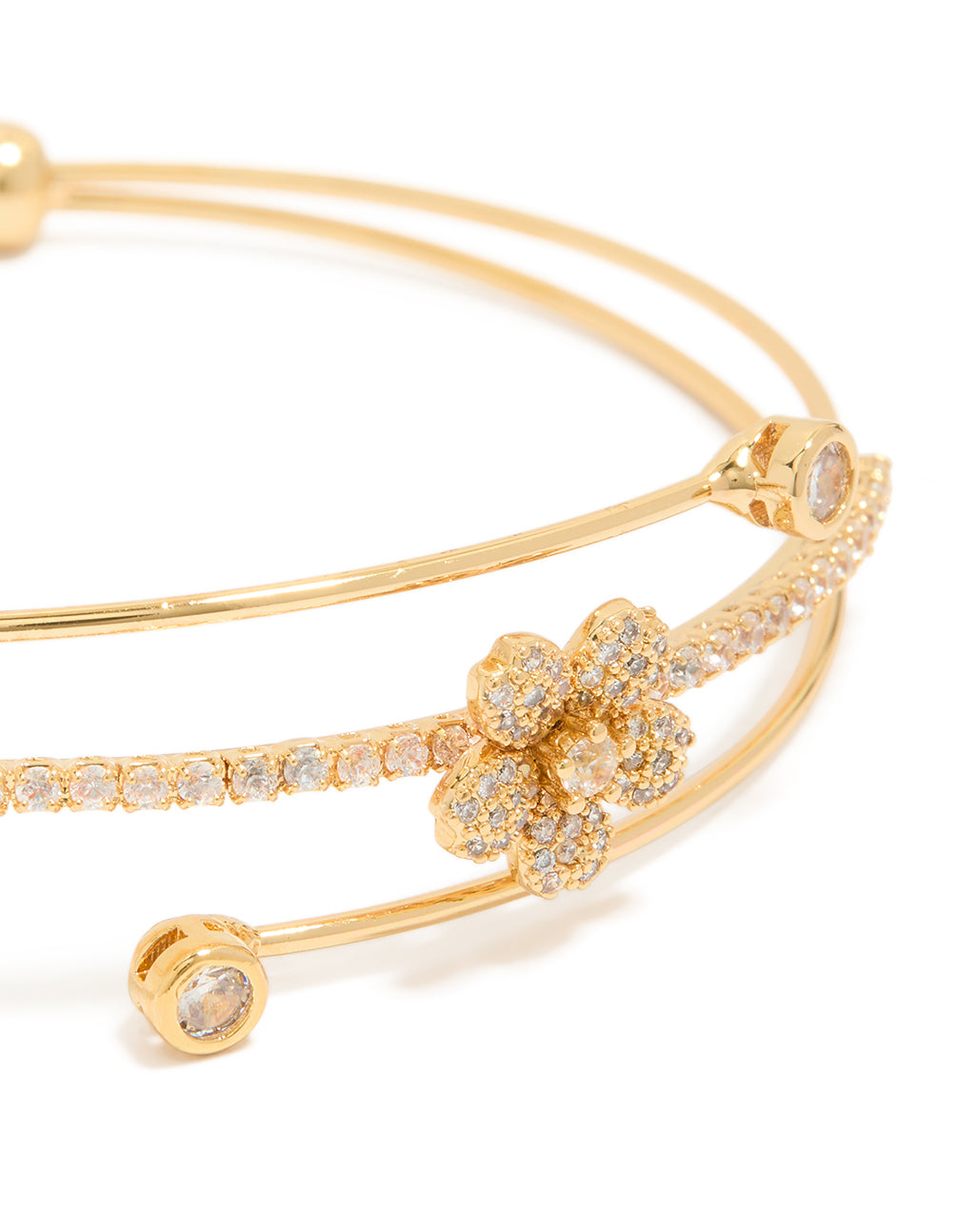 Stunning gold plated cubic zirconia flower wrist cuff showcasing floral with crystal embellishments gold close up view