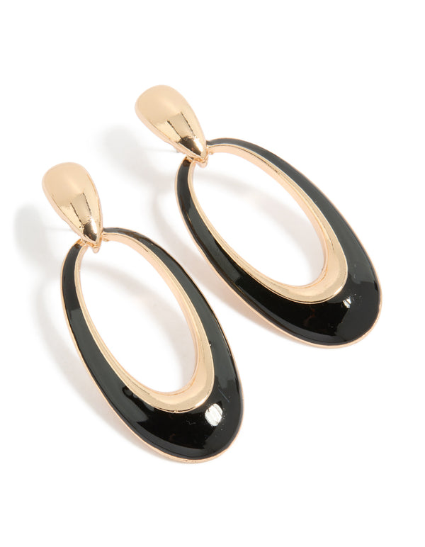 Striking statement drop earrings featuring hollow oval design with black enamel detailing in gold front view