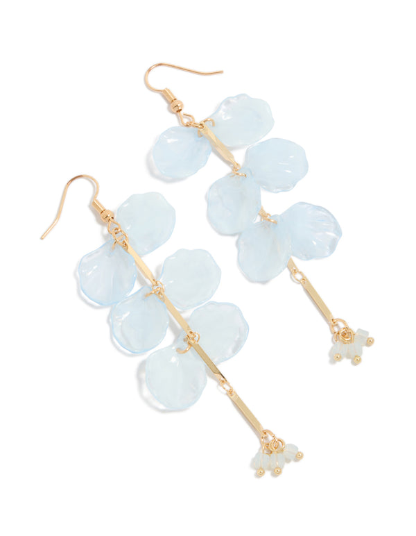 Showcasing gold beaded and light blue drop earrings with floral petal details front view