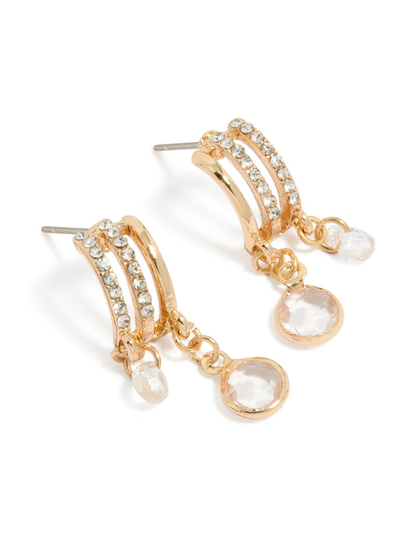 Showcasing gold diamante drop layered huggie earrings with charm closure front view