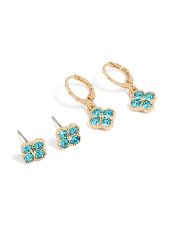 Featuring floral diamante stud and huggie earrings in a 2-pack set with turquoise stones and gold finish front view