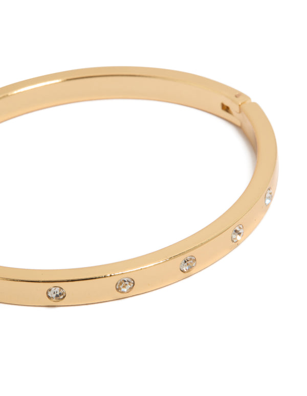 Showcasing gold plated diamante circle inlay bangle with stone close up view