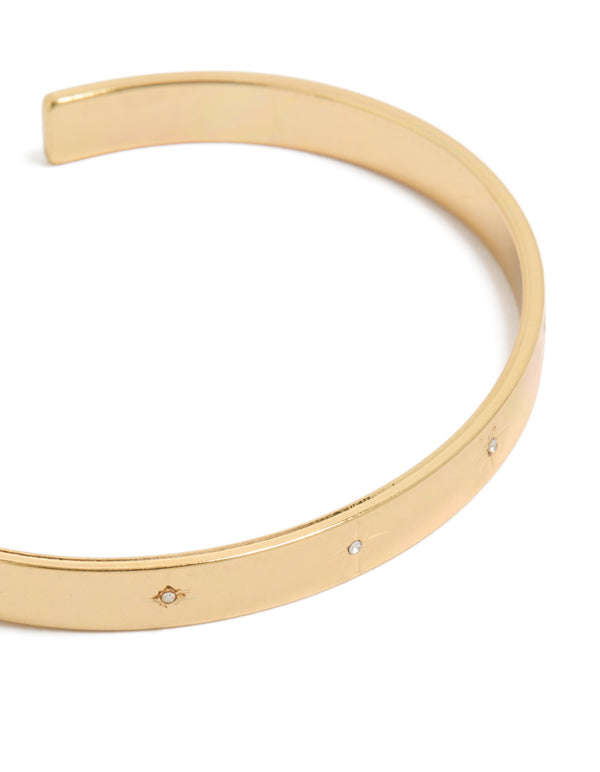 Elegant celestial star diamante wrist cuff in gold plated finish close up view