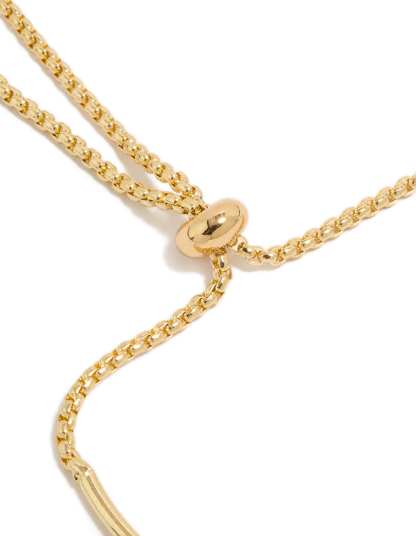 Finely detailed gold plated cubic zirconia and flower charms toggle bangle with oval stone crystal accents closure detail view