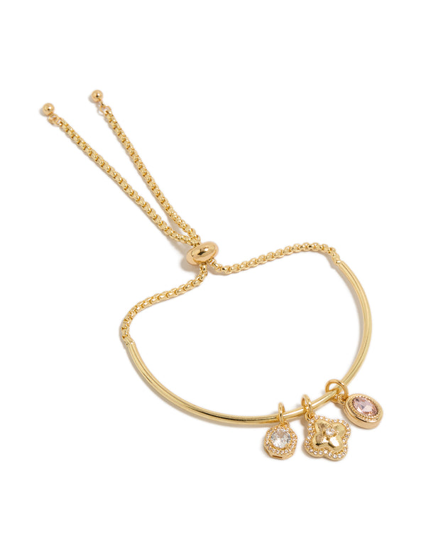 Beautifully crafted gold plated cubic zirconia and flower charms toggle bangle with oval stone and crystal accents front view