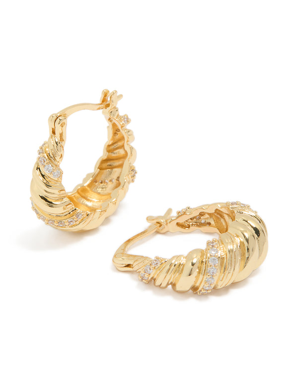 Showcasing gold plated twist huggie earrings featuring cubic zirconia front view