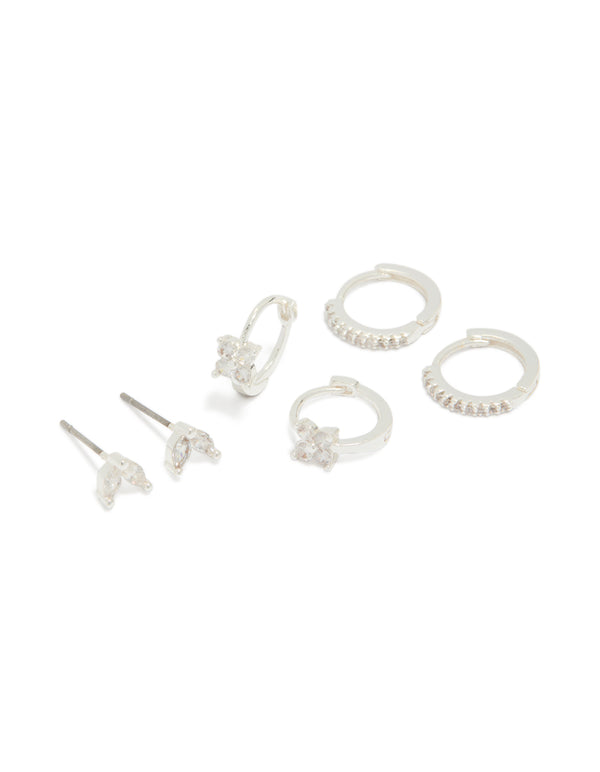 Showcasing silver plated flower huggie and leaf stud earrings in a 3-pack front view