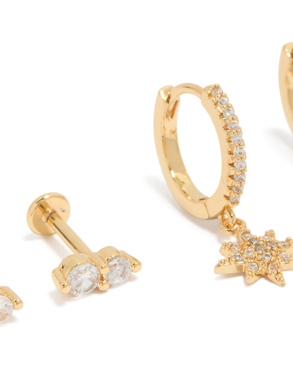 Displaying celestial charm pack with star accents, cubic zirconia crystals, flat back studs and huggie closures in gold plated brass close up view
