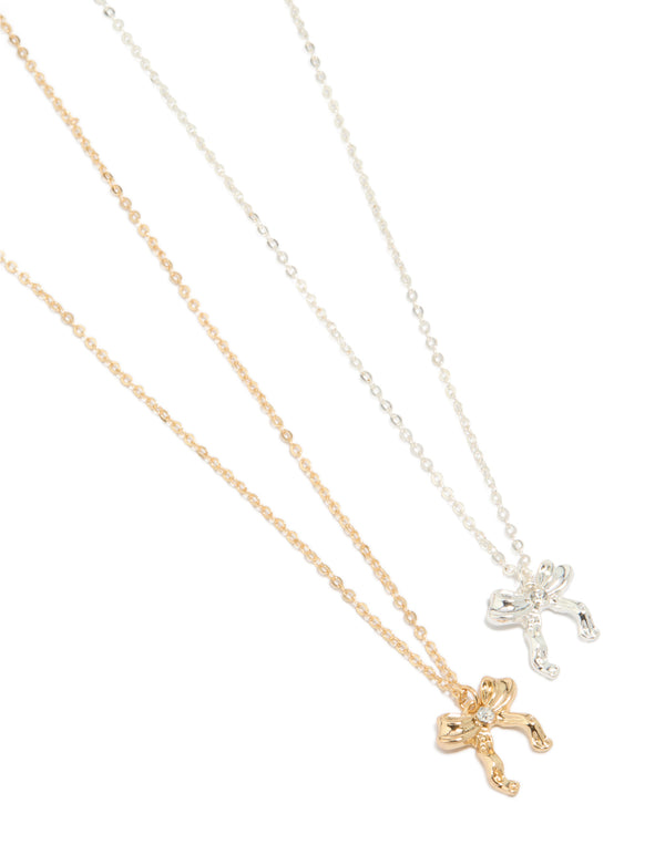 Discover a bow pendant necklace 2-pack in gold and silver close up view