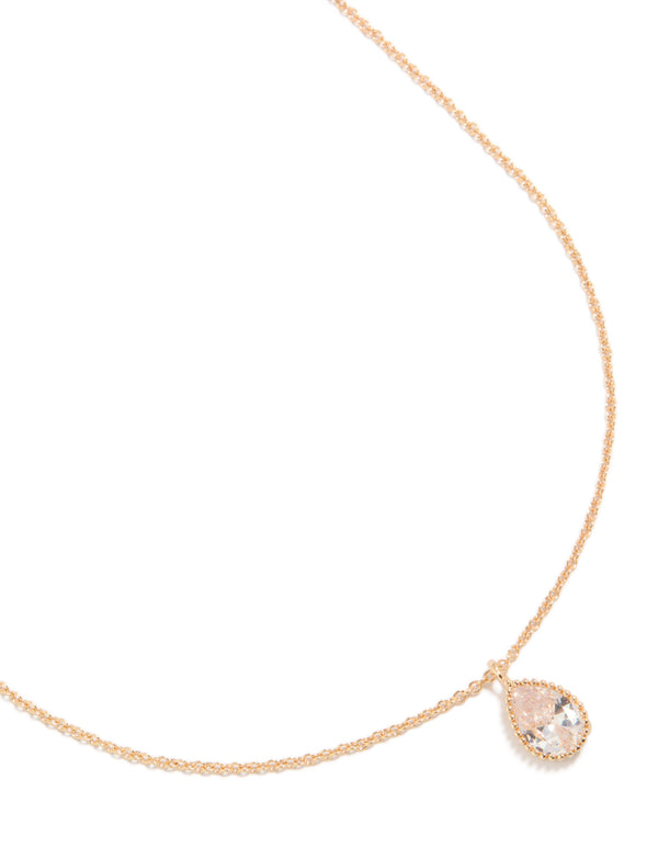 Showcasing a gold cubic zirconia teardrop pendant necklace close up view