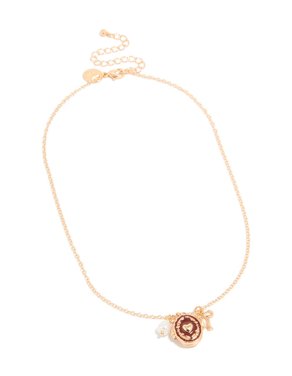 Elegant gold bow charm heart locket necklace featuring pearl pendant front view