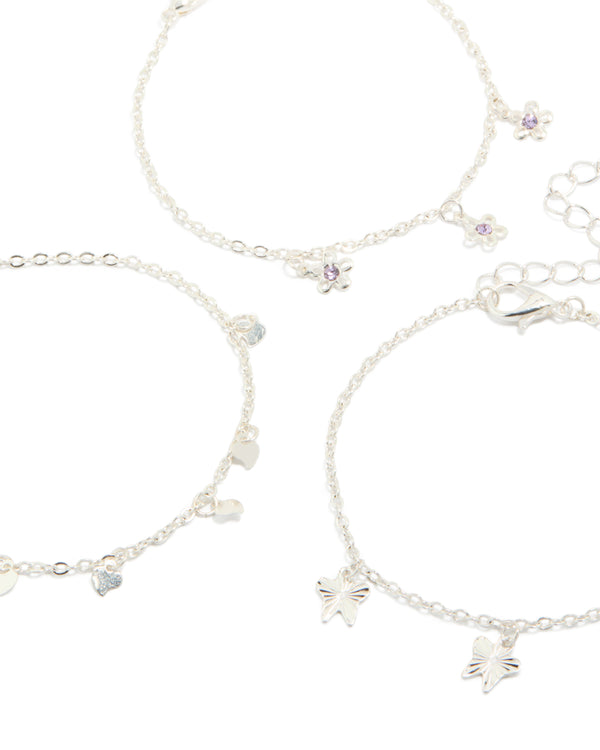 Crafted from silver, these dainty garden bracelets in a 3-pack feature butterfly, floral and heart charms close up view