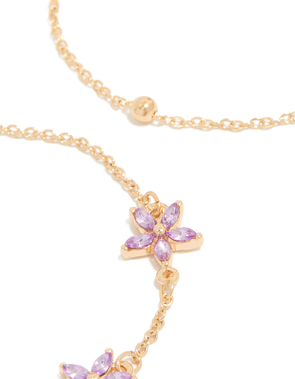 Crafted with delicate chain links featuring diamante lavender floral and gold beads close up view