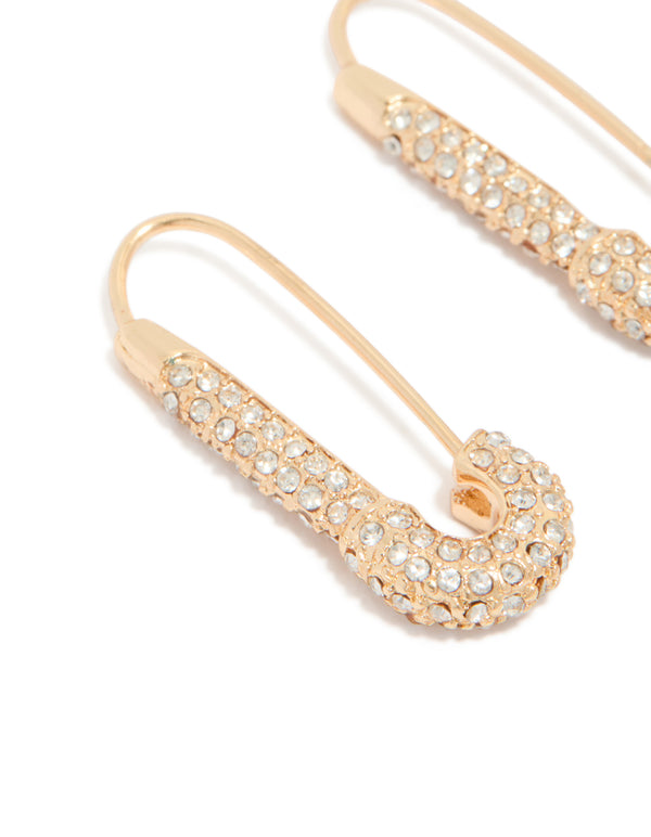 Crafted with gold diamante safety pin hoop earrings featuring clear stones in a close up view