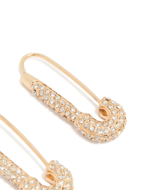 Highlighting gold diamante safety pin hoop earrings with sparkling clear stones showing intricate post detail view