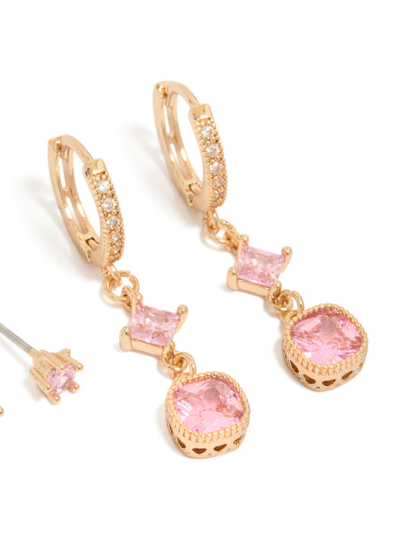 Featuring gold pink cubic zirconia stud and huggie earrings 2-pack with charm details and crystal accents close up view