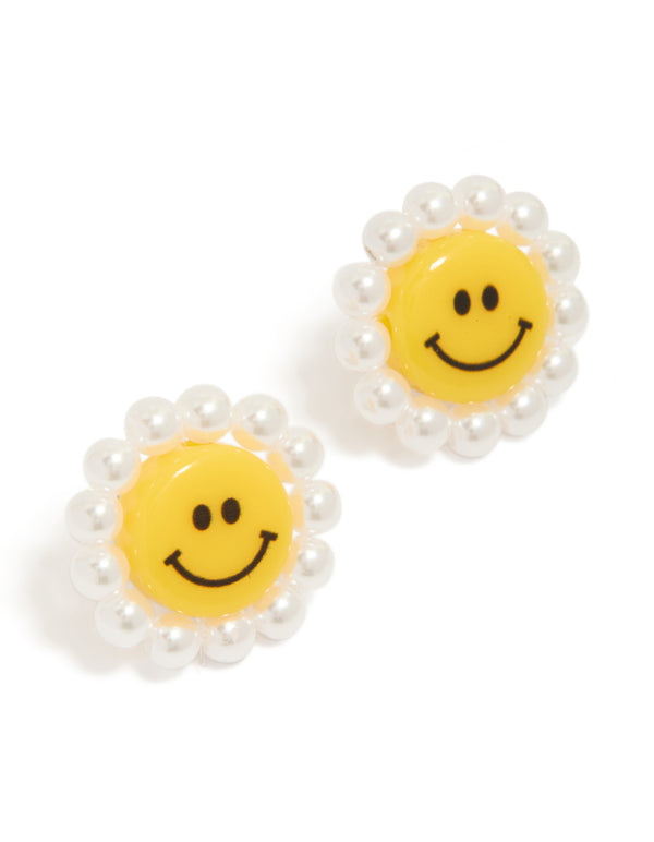 Showcasing floral stud earrings with pearl detailing in yellow and white front view