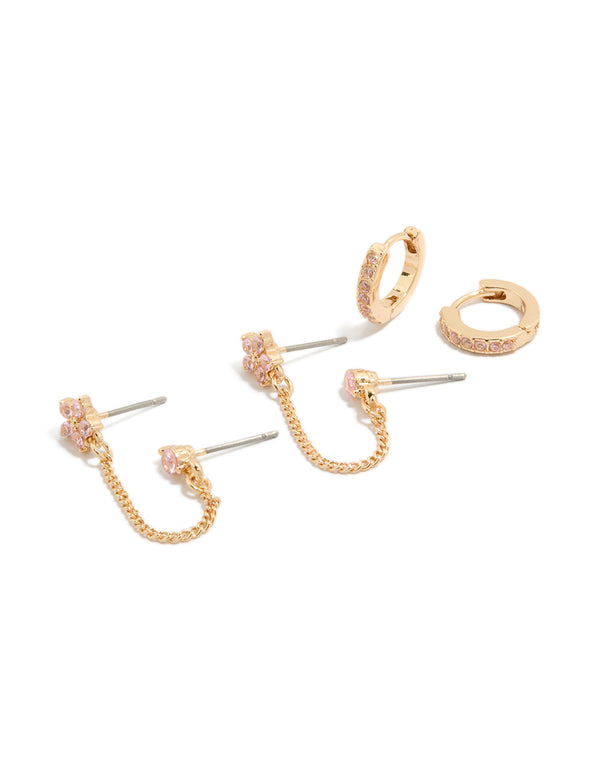 Presenting a gold pink cubic zirconia chain flower and huggie earrings pack with floral featuring crystal embellishments and stud huggie closures front view