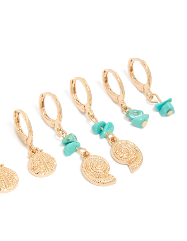 Designed with gold hoop closures, this sea life 6-pack features shell and ocean charms with turquoise beads and pearl details post detail view